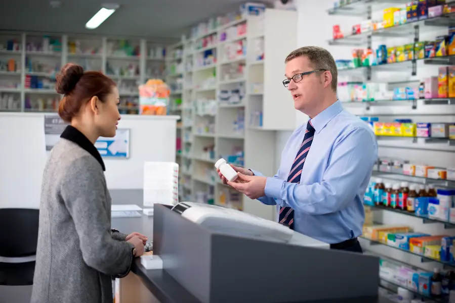 Pharmacist helping customer